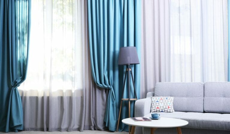 How to Hang Curtains Over Blinds That Stick Out?