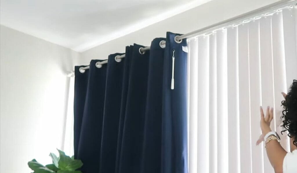 How to Hang Curtains Over Blinds That Stick Out?